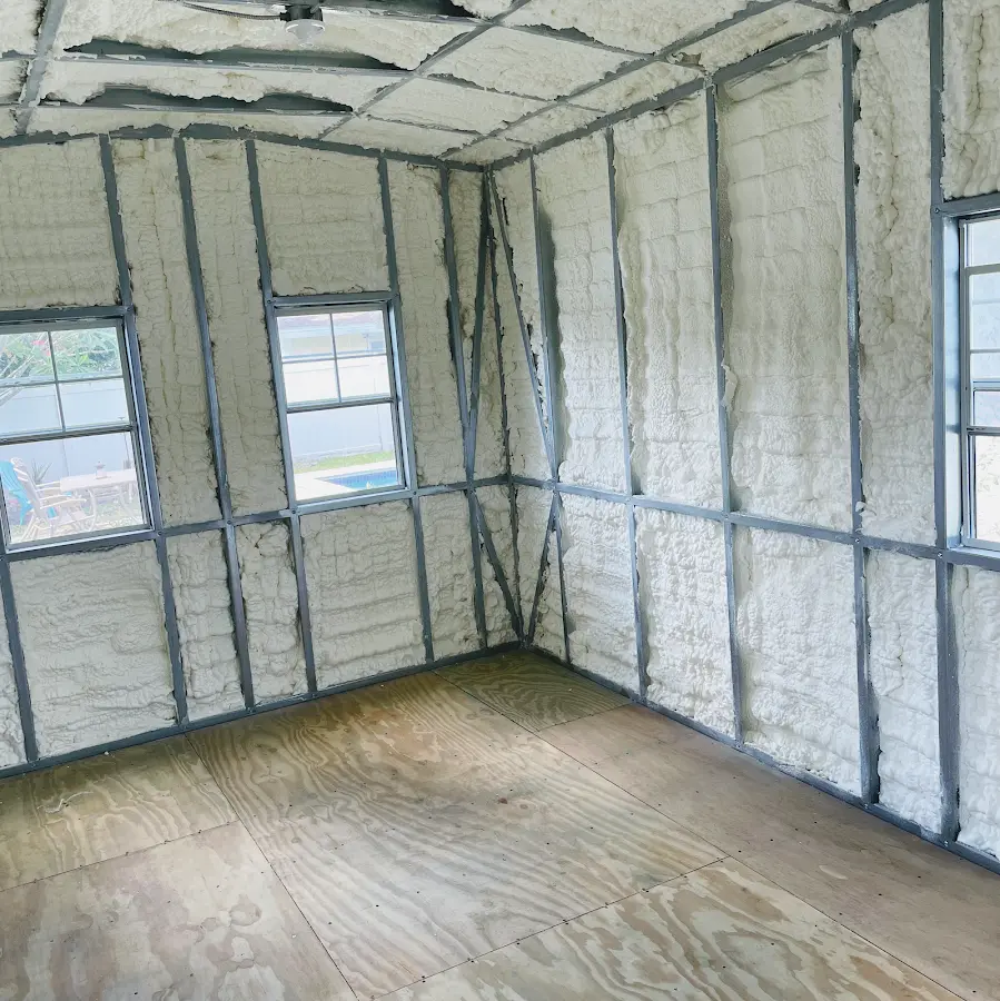 Closed-cell spray foam insulation applied to wall cavities in a residential project in Edina